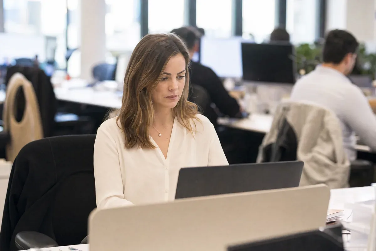 Broker reviewing a business funding application at a desk