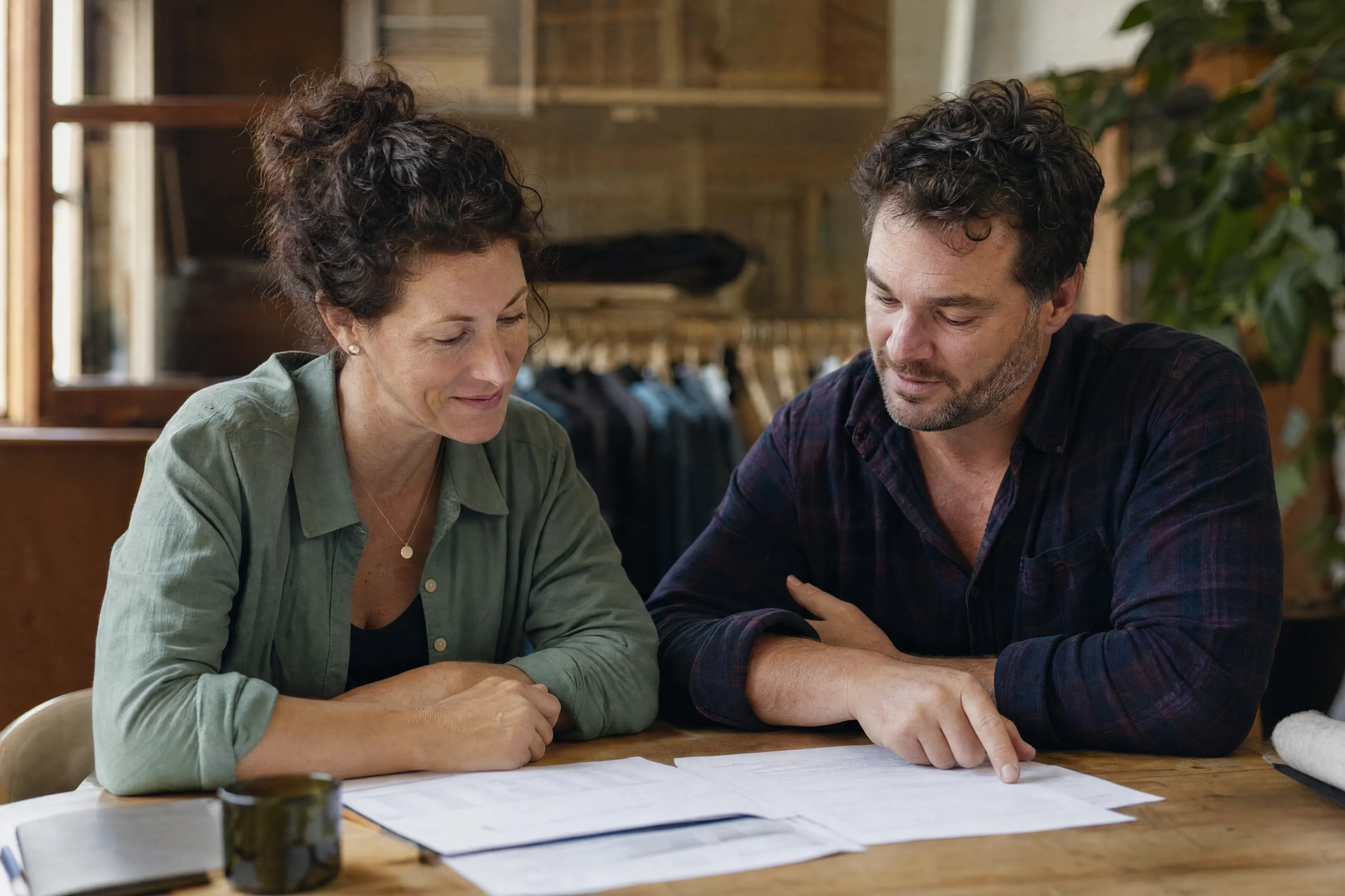 Business owners planning their borrowing at a table